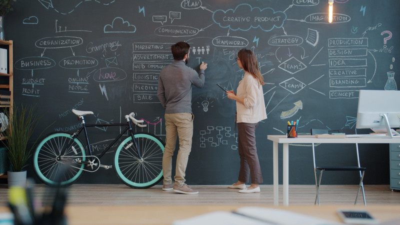 The team at the studio's chalkboard wall.